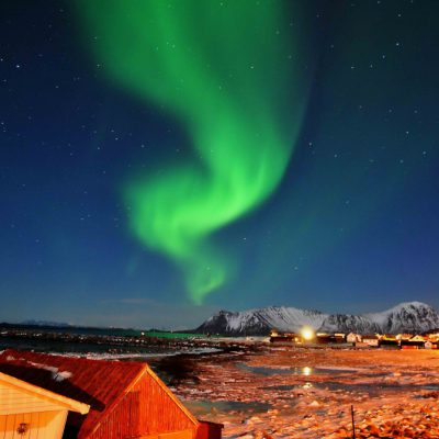 A stunning display of the aurora borealis illuminating Lofoten's landscape