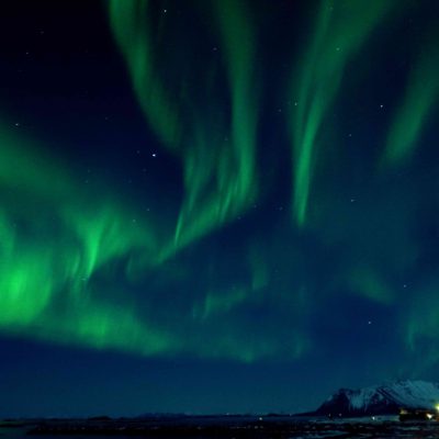 Northern Lights creating a magical atmosphere in Lofoten